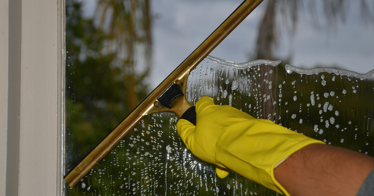 window being cleaned by a professional with years of experience